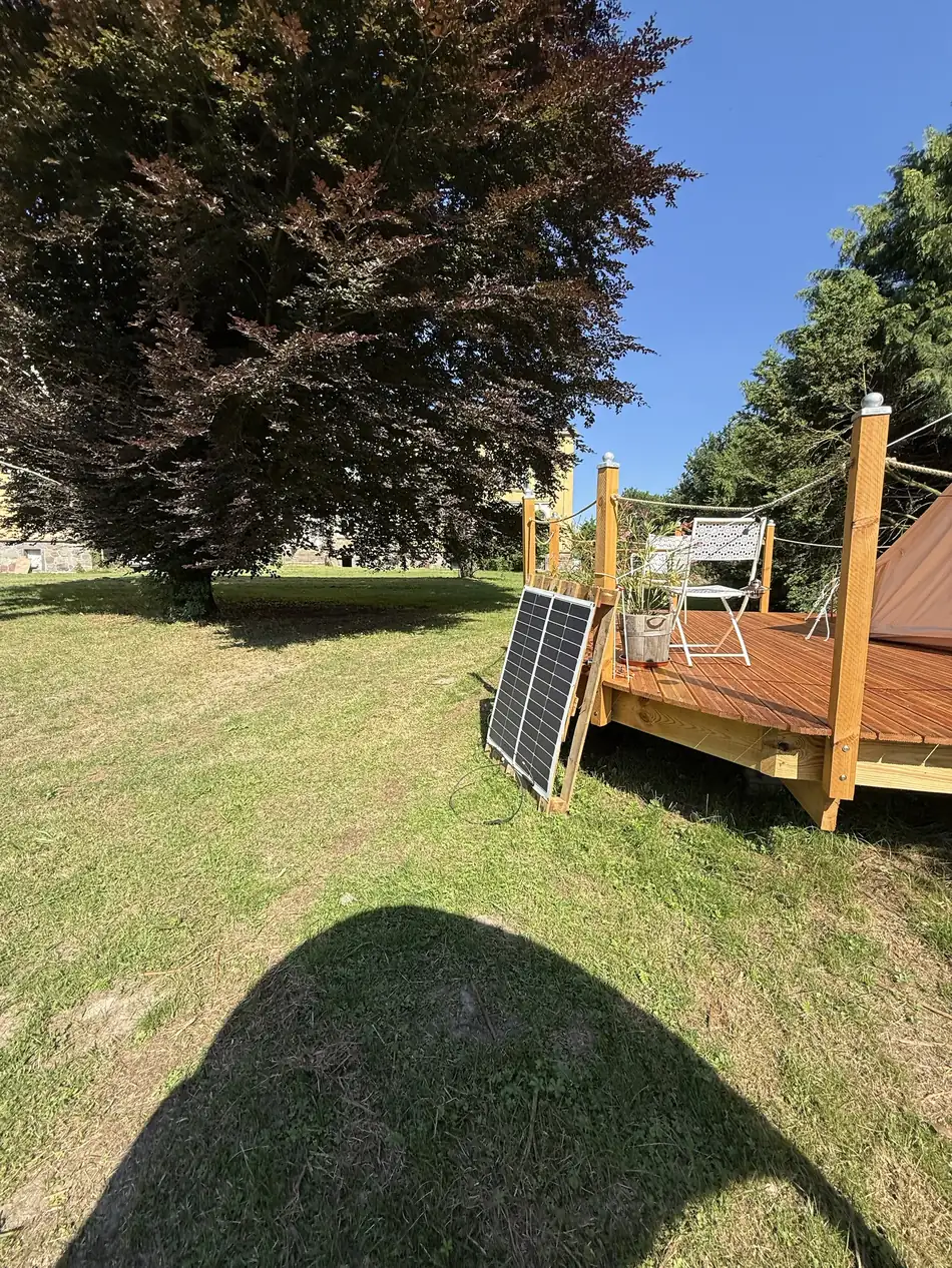 The deck in the park – the manor house to the left, solar panel in front